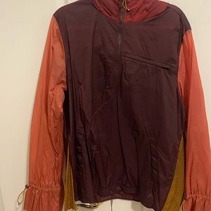 Super lightweight and colorful. Has many pockets and is a nice throw-over item.